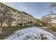 Low angle exterior of a multi-story apartment building with snow on the lawn at 675 S Alton Way # 7A, Denver, CO 80247