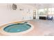 Indoor hot tub features a soothing spa experience with abundant natural light streaming through large windows at 675 S Alton Way # 7A, Denver, CO 80247
