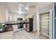 Functional kitchen with stainless steel appliances, wood cabinets, and ample storage space at 675 S Alton Way # 7A, Denver, CO 80247