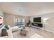 Open-concept living room boasts a fireplace, modern decor, recessed lighting, and glass sliding doors to the outside at 675 S Alton Way # 7A, Denver, CO 80247