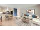 Bright living room featuring wood floors, neutral paint, an area rug, dining table, and modern furniture at 675 S Alton Way # 7A, Denver, CO 80247