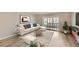 Open-concept living room boasts a fireplace, modern decor, recessed lighting, and glass sliding doors to the outside at 675 S Alton Way # 7A, Denver, CO 80247
