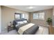 Comfortable main bedroom with neutral walls, area rug, and a large window providing natural light at 675 S Alton Way # 7A, Denver, CO 80247