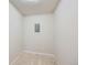 Small room with neutral carpet, white walls, and gray electrical panel at 675 S Alton Way # 7A, Denver, CO 80247