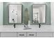 Bathroom featuring double vanity, modern faucets and a decorative leaf at 9487 W 58Th Ln # C, Arvada, CO 80002