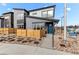 Contemporary two-story home showcases modern architecture, blue front door, and low maintenance yard at 9487 W 58Th Ln # C, Arvada, CO 80002