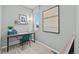 Cozy office space with a desk, chair, artwork, and a view from the window at 9487 W 58Th Ln # C, Arvada, CO 80002