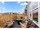 Cozy patio area with a fire pit, seating, and wood fence offering a relaxing outdoor space at 9487 W 58Th Ln # C, Arvada, CO 80002