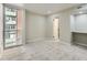 Spacious carpeted bedroom features an ensuite bathroom and an alcove for a desk or storage at 1070 Race St # H, Denver, CO 80206