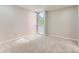 Cozy bedroom with a big window letting in natural light and soft, neutral carpeting at 1070 Race St # H, Denver, CO 80206