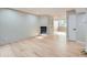 Cozy living room featuring a fireplace, hardwood floors, and built-in display cabinet at 1070 Race St # H, Denver, CO 80206