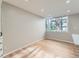 Bright living room with hardwood floors and a large window with views to the outside at 1070 Race St # H, Denver, CO 80206