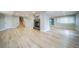 Spacious finished basement with hardwood floors, fireplace, and stairs to the upper level at 4532 Christensen Cir, Littleton, CO 80123