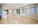Finished basement with hardwood floors, bar area, and walk-out access to the yard at 4532 Christensen Cir, Littleton, CO 80123