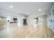 Basement featuring hardwood floors, a fireplace, bar area, and a media center at 4532 Christensen Cir, Littleton, CO 80123