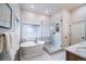 Luxurious bathroom with soaking tub and walk-in glass shower at 4532 Christensen Cir, Littleton, CO 80123