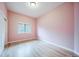 Bedroom with hardwood floors, natural light, and neutral walls at 4532 Christensen Cir, Littleton, CO 80123