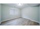 Bedroom with hardwood floors and a window at 4532 Christensen Cir, Littleton, CO 80123