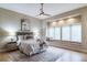 This bedroom boasts a decorative rug, ceiling fan, and natural lighting from the window seat at 4532 Christensen Cir, Littleton, CO 80123