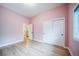 Bedroom with hardwood floors, natural light, and neutral walls at 4532 Christensen Cir, Littleton, CO 80123