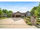 Charming single-story home with an extra long driveway, three-car garage and perfectly landscaped front yard at 4532 Christensen Cir, Littleton, CO 80123