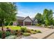 Beautiful home with a three-car garage, gorgeous landscaping, mature trees and a perfectly manicured lawn at 4532 Christensen Cir, Littleton, CO 80123
