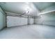 Spacious three-car garage with a sealed floor, perfect for car enthusiasts or extra storage at 4532 Christensen Cir, Littleton, CO 80123