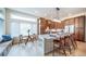 Kitchen with island and seating features wood cabinets, stainless appliances, and modern lighting at 4532 Christensen Cir, Littleton, CO 80123