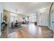 Bright and spacious living room and dining area with hardwood floors and large windows with plenty of light at 4532 Christensen Cir, Littleton, CO 80123