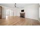 Bright living room boasts hardwood floors, fireplace, and an open floorplan at 4532 Christensen Cir, Littleton, CO 80123