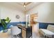 Well-lit office with hardwood floors, stylish decor, and French doors leading to other rooms at 4532 Christensen Cir, Littleton, CO 80123