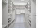 This walk-in closet offers plenty of shelving, drawer, and rack space for storage and organization at 4532 Christensen Cir, Littleton, CO 80123
