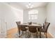 Inviting dining room featuring hardwood floors and a stylish rustic wooden table with chairs at 9763 E Carolina Pl, Aurora, CO 80247