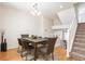 Dining room showcasing hardwood floors, a rustic wooden table and seating for six at 9763 E Carolina Pl, Aurora, CO 80247