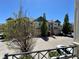 Townhome complex with multiple units, garages, and landscaping seen from an elevated view at 9763 E Carolina Pl, Aurora, CO 80247
