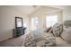 Bright and spacious main bedroom with plush carpet, and walk-out balcony at 9763 E Carolina Pl, Aurora, CO 80247