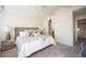 Tastefully decorated main bedroom with plush carpet, vaulted ceiling and connecting bathroom at 9763 E Carolina Pl, Aurora, CO 80247