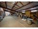 Spacious barn featuring high ceilings, concrete floors, and ample storage space for equipment and activities at 8838 Hillview Rd, Morrison, CO 80465