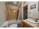 Bathroom with bathtub, tile shower and updated vanity at 8838 Hillview Rd, Morrison, CO 80465