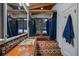 Unique bathroom with vibrant tile work, a soaking tub, and natural lighting at 8838 Hillview Rd, Morrison, CO 80465