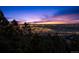 Stunning elevated view of the city lights at night with majestic mountain backdrop at 8838 Hillview Rd, Morrison, CO 80465