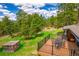 Inviting deck with a metal railing, outdoor furniture, and an adjacent enclosed area at 8838 Hillview Rd, Morrison, CO 80465