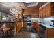 Well-equipped kitchen with stone accents, stainless steel appliances, and custom wood cabinetry at 8838 Hillview Rd, Morrison, CO 80465
