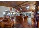 Cozy living room with stone tile floors, skylights, and comfortable leather furnishings at 8838 Hillview Rd, Morrison, CO 80465