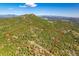 Beautiful aerial view of property lines with a lush forest and rolling hills in the background at 8838 Hillview Rd, Morrison, CO 80465
