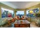 Comfortable sun room with scenic overlook and multiple windows providing natural light at 8838 Hillview Rd, Morrison, CO 80465