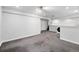 Spacious basement featuring carpet, neutral walls, and access to laundry at 2495 S Lansing Way, Aurora, CO 80014