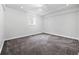 Finished basement with carpet and lighting, a versatile space for various uses at 2495 S Lansing Way, Aurora, CO 80014