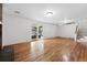 The basement has hardwood floors, sliding glass doors to the backyard and access to the staircase at 2495 S Lansing Way, Aurora, CO 80014