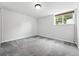 Finished basement provides a flexible living area with natural light and neutral carpeting at 2495 S Lansing Way, Aurora, CO 80014